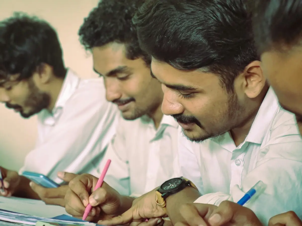 Young graduates working together at a table